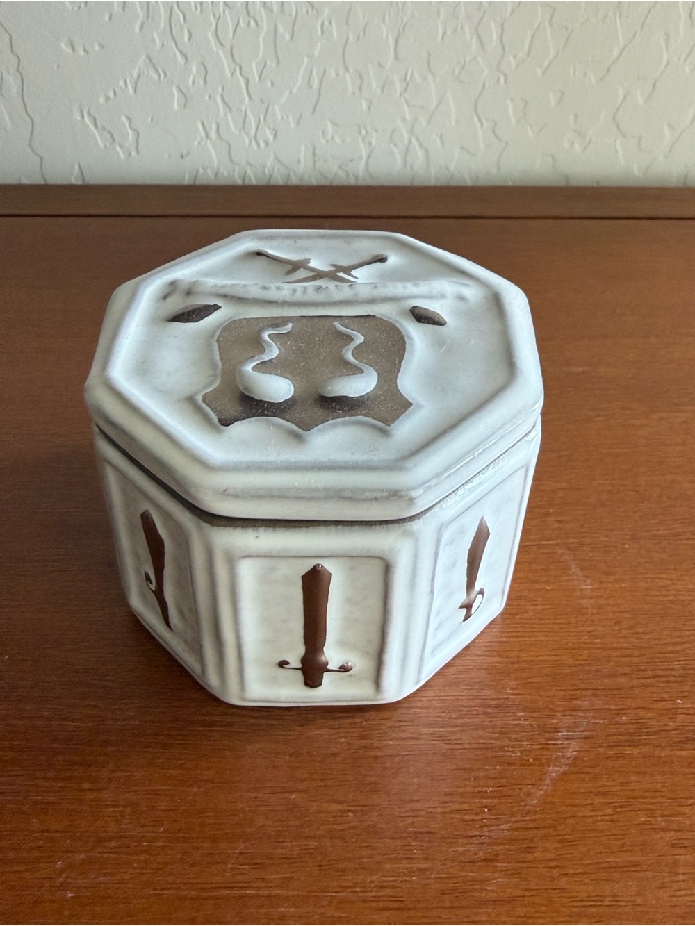 Jonathan Adler Octagonal Ceramic Trinket Box in Cream, brown, and silver.